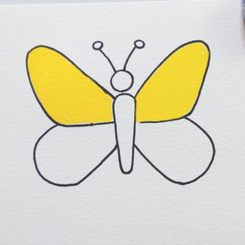 Butterfly drawing colored yellow on the upper part of the wings