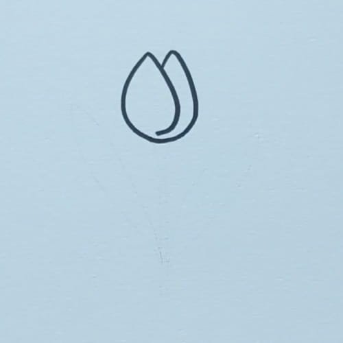 Simple tulip bud shape drawn for an easy tulip drawing for kids tutorial.